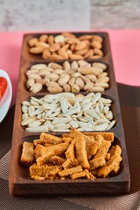 Pistachios, sunflower seeds, almonds, crackers