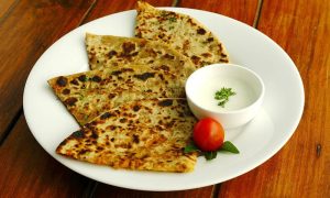 Vegetable stuffed paratha with curd